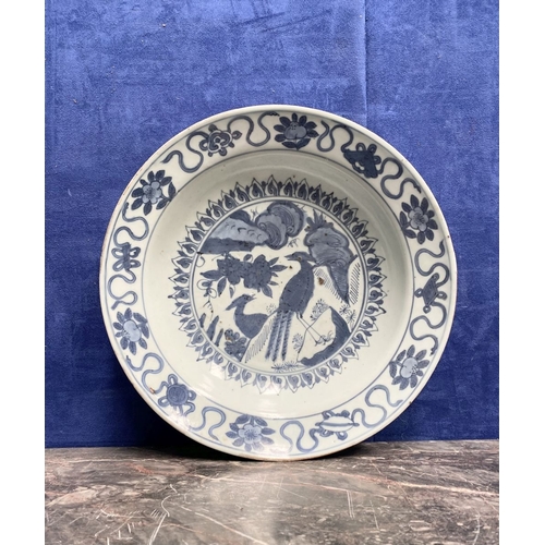199 - A CHINESE BLUE AND WHITE 'SWATOW' CHARGER of deep circular form, resting atop short foot, late Ming ... 