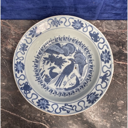 199 - A CHINESE BLUE AND WHITE 'SWATOW' CHARGER of deep circular form, resting atop short foot, late Ming ... 