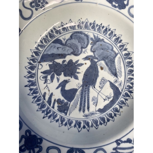 199 - A CHINESE BLUE AND WHITE 'SWATOW' CHARGER of deep circular form, resting atop short foot, late Ming ... 