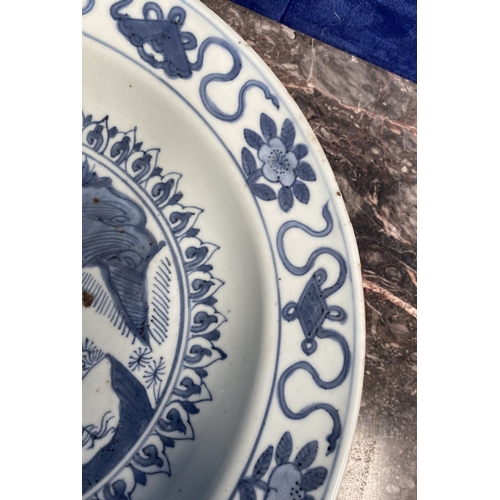 199 - A CHINESE BLUE AND WHITE 'SWATOW' CHARGER of deep circular form, resting atop short foot, late Ming ... 