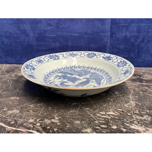 199 - A CHINESE BLUE AND WHITE 'SWATOW' CHARGER of deep circular form, resting atop short foot, late Ming ... 