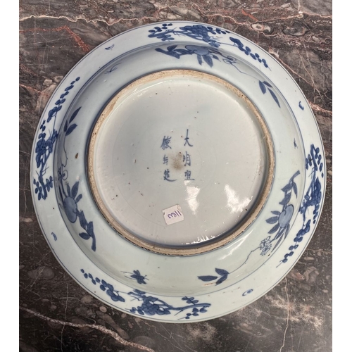 199 - A CHINESE BLUE AND WHITE 'SWATOW' CHARGER of deep circular form, resting atop short foot, late Ming ... 