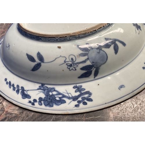 199 - A CHINESE BLUE AND WHITE 'SWATOW' CHARGER of deep circular form, resting atop short foot, late Ming ... 
