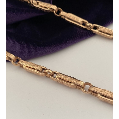 20 - A HEAVY 9CT ROSEGOLD NECKLACE, thick fancy paperclip chain links, each with decorative textured engr... 
