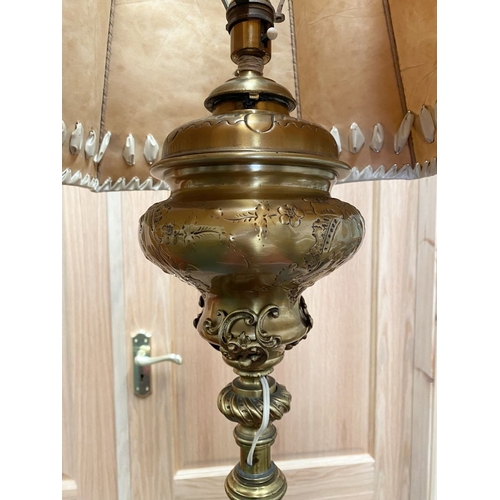 202 - A GILT BRASS FLOOR STANDARD LAMP, highly decorative with engraved details to cylindrical & knopped t... 
