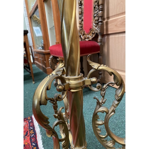 202 - A GILT BRASS FLOOR STANDARD LAMP, highly decorative with engraved details to cylindrical & knopped t... 