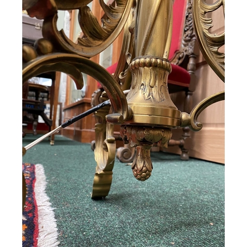 202 - A GILT BRASS FLOOR STANDARD LAMP, highly decorative with engraved details to cylindrical & knopped t... 