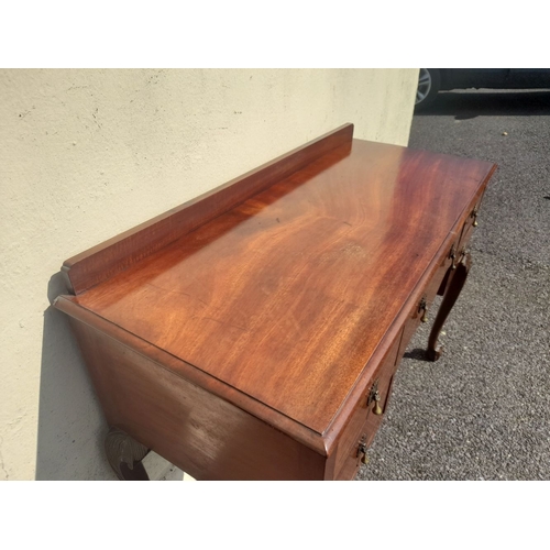 203 - A MAHOGANY QUEEN ANNE STYLE WRITING DESK, with raised gallery to back, five drawers with brass drop ... 