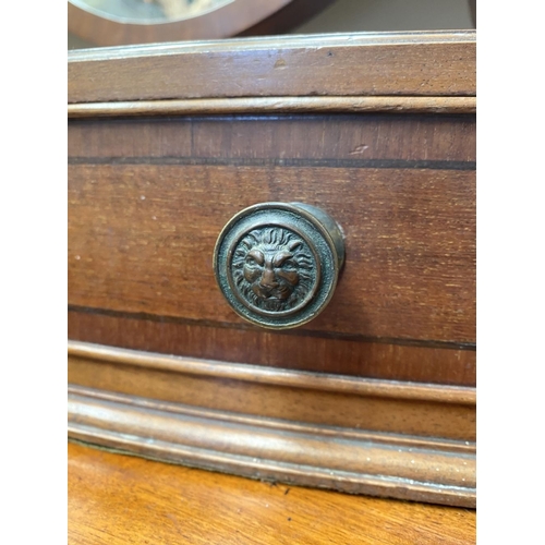 206 - A 19TH CENTURY MAHOGANY DRESSING TABLE MIRROR, oval mirror in scroll supports, atop bow fronted base... 