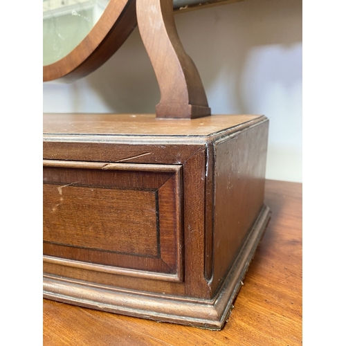206 - A 19TH CENTURY MAHOGANY DRESSING TABLE MIRROR, oval mirror in scroll supports, atop bow fronted base... 