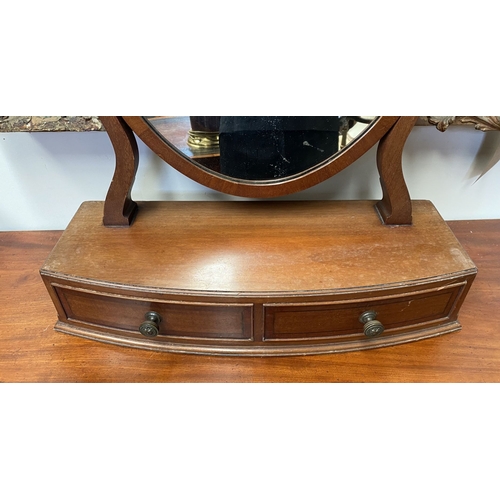 206 - A 19TH CENTURY MAHOGANY DRESSING TABLE MIRROR, oval mirror in scroll supports, atop bow fronted base... 