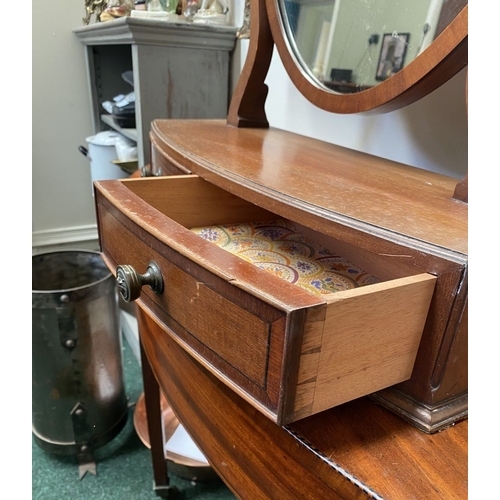 206 - A 19TH CENTURY MAHOGANY DRESSING TABLE MIRROR, oval mirror in scroll supports, atop bow fronted base... 