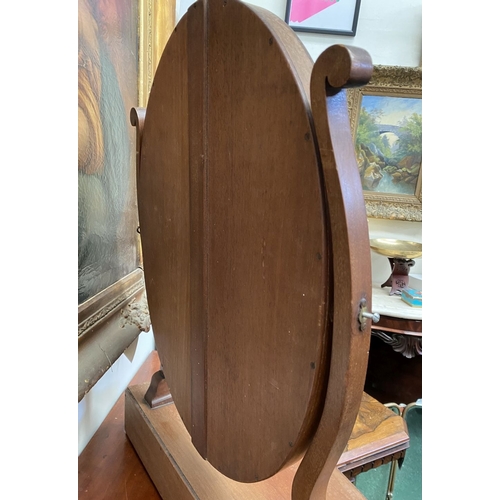 206 - A 19TH CENTURY MAHOGANY DRESSING TABLE MIRROR, oval mirror in scroll supports, atop bow fronted base... 