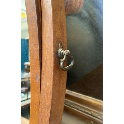 206 - A 19TH CENTURY MAHOGANY DRESSING TABLE MIRROR, oval mirror in scroll supports, atop bow fronted base... 