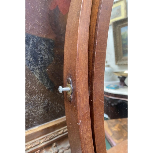 206 - A 19TH CENTURY MAHOGANY DRESSING TABLE MIRROR, oval mirror in scroll supports, atop bow fronted base... 