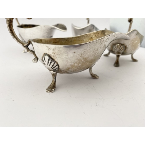 217 - A SILVERPLATE LOT TO INCLUDE: A SET OF FOUR VINTAGE HEAVY SILVER-PLATE SAUCE BOATS, VINTAGE SILVER-P... 