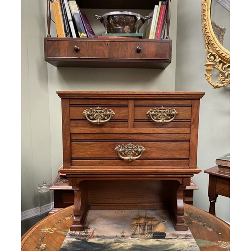 218 - A MAHOGANY APPRENTICE THREE DRAWER CHEST, with two short over one long drawer, each with brass handl... 