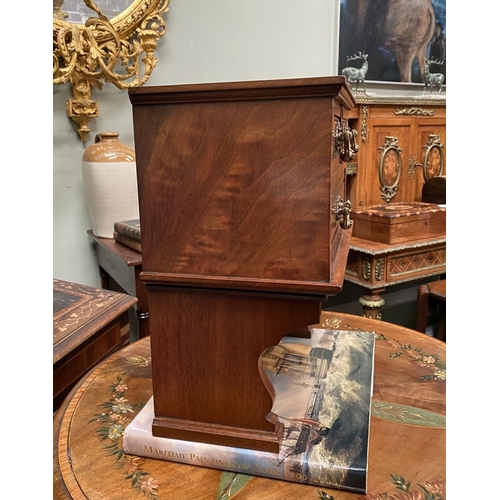 218 - A MAHOGANY APPRENTICE THREE DRAWER CHEST, with two short over one long drawer, each with brass handl... 