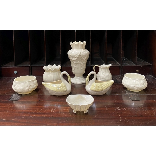 221 - A COLLECTION OF BELLEEK, to include cream jug, three sugar bowls two matching, a vase & pair of swan... 