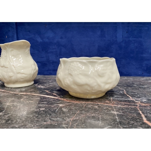 221 - A COLLECTION OF BELLEEK, to include cream jug, three sugar bowls two matching, a vase & pair of swan... 