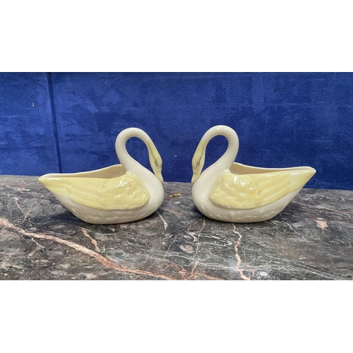 221 - A COLLECTION OF BELLEEK, to include cream jug, three sugar bowls two matching, a vase & pair of swan... 