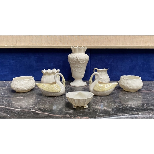 221 - A COLLECTION OF BELLEEK, to include cream jug, three sugar bowls two matching, a vase & pair of swan... 