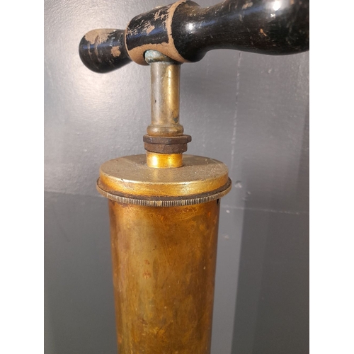 224 - A VINTAGE BRASS CAR TYRE PUMP, c.1910-20, hardwood handle to top, dimensions: 62cm high x 10cm wide ... 
