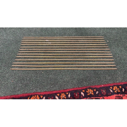 227 - A SET OF 13 BRASS STAIR RODS, condition as photographed, dimensions: 62.5cm long approx.