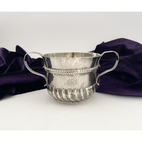 23 - AN EARLY GEORGE I SILVER PORRINGER BOWL, Hallmarked with Makers mark James Goodwin, London c.1714. T... 
