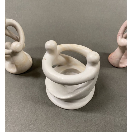 233 - A TRIO OF CARVED SOAPSTONE SCULPTURES, central ‘unity’/’circle of friends’ can be used as a tealight... 