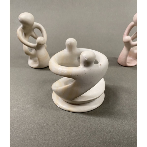 233 - A TRIO OF CARVED SOAPSTONE SCULPTURES, central ‘unity’/’circle of friends’ can be used as a tealight... 