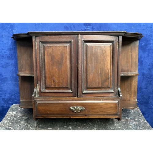 234 - AN ANTIQUE MAHOGANY HANGING CABINET, with shaped reeded border to top above two panelled doors over ... 