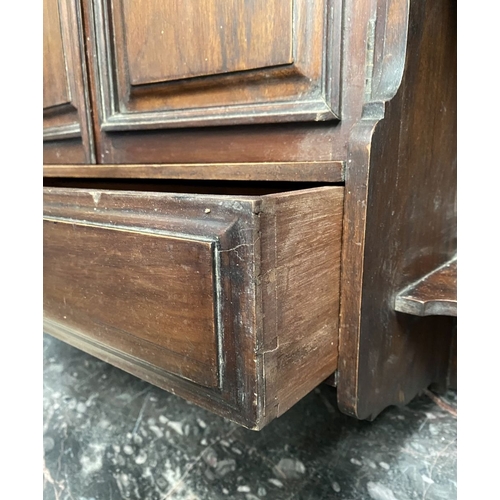234 - AN ANTIQUE MAHOGANY HANGING CABINET, with shaped reeded border to top above two panelled doors over ... 