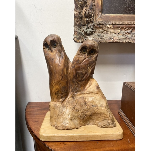 235 - A HARDWOOD CARVED OWL SCULPTURE, carved from one piece of wood, the owls with beaded eyes. On rectan... 