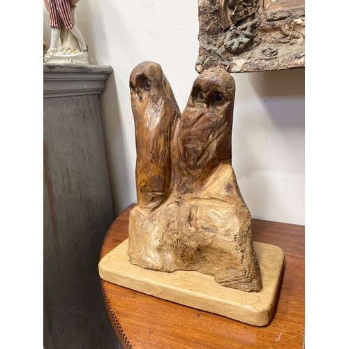 235 - A HARDWOOD CARVED OWL SCULPTURE, carved from one piece of wood, the owls with beaded eyes. On rectan... 