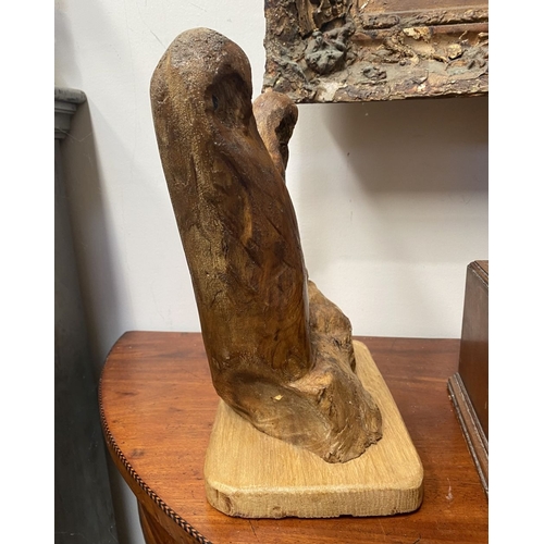 235 - A HARDWOOD CARVED OWL SCULPTURE, carved from one piece of wood, the owls with beaded eyes. On rectan... 