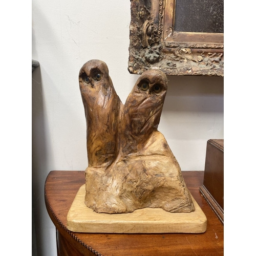 235 - A HARDWOOD CARVED OWL SCULPTURE, carved from one piece of wood, the owls with beaded eyes. On rectan... 
