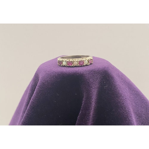 241 - A LOVELY SILVER OPAL & PINK GEMSTONE SEVEN STONE RING, with four round cut pink gemstones separated ... 