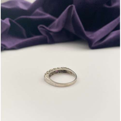 241 - A LOVELY SILVER OPAL & PINK GEMSTONE SEVEN STONE RING, with four round cut pink gemstones separated ... 
