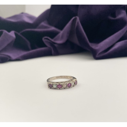 241 - A LOVELY SILVER OPAL & PINK GEMSTONE SEVEN STONE RING, with four round cut pink gemstones separated ... 