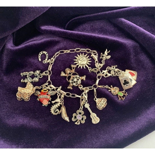 246 - A STERLING SILVER CHARM BRACELET, cable chain bracelet, hallmarked 925 to clasp, & 925 Italy, with 1... 