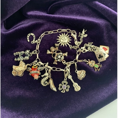246 - A STERLING SILVER CHARM BRACELET, cable chain bracelet, hallmarked 925 to clasp, & 925 Italy, with 1... 