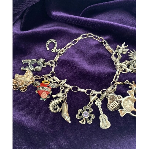 246 - A STERLING SILVER CHARM BRACELET, cable chain bracelet, hallmarked 925 to clasp, & 925 Italy, with 1... 
