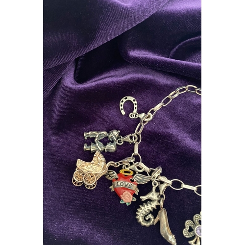 246 - A STERLING SILVER CHARM BRACELET, cable chain bracelet, hallmarked 925 to clasp, & 925 Italy, with 1... 
