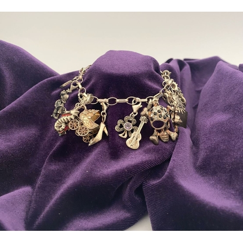 246 - A STERLING SILVER CHARM BRACELET, cable chain bracelet, hallmarked 925 to clasp, & 925 Italy, with 1... 