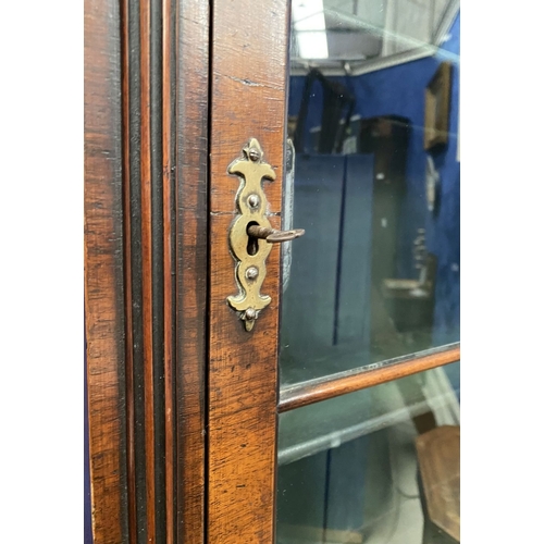 25 - A MAHOGANY QUEEN ANNE STYLE BUREAU BOOKCASE, the carved pediment to arched top with shell motif to c... 