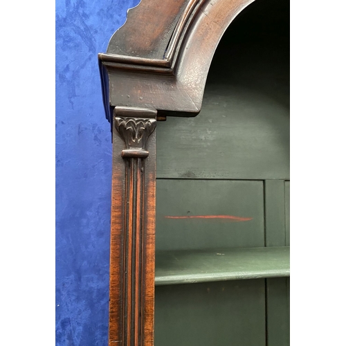 25 - A MAHOGANY QUEEN ANNE STYLE BUREAU BOOKCASE, the carved pediment to arched top with shell motif to c... 