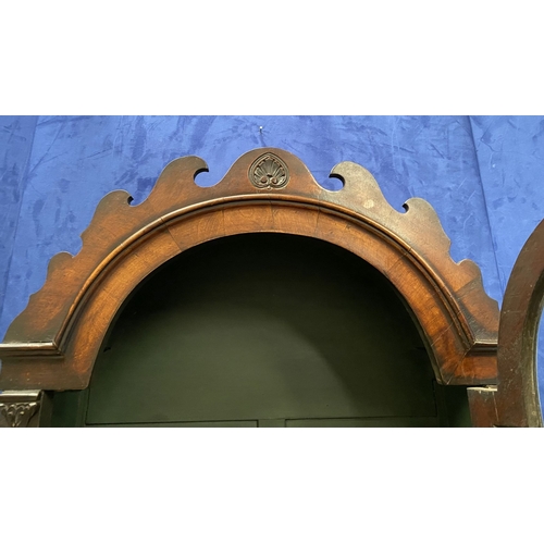 25 - A MAHOGANY QUEEN ANNE STYLE BUREAU BOOKCASE, the carved pediment to arched top with shell motif to c... 