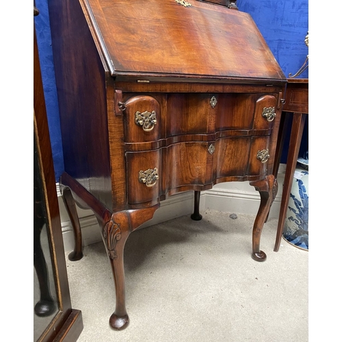 25 - A MAHOGANY QUEEN ANNE STYLE BUREAU BOOKCASE, the carved pediment to arched top with shell motif to c... 