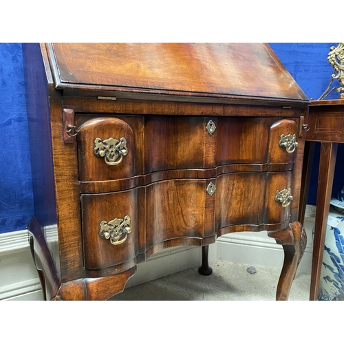 25 - A MAHOGANY QUEEN ANNE STYLE BUREAU BOOKCASE, the carved pediment to arched top with shell motif to c... 